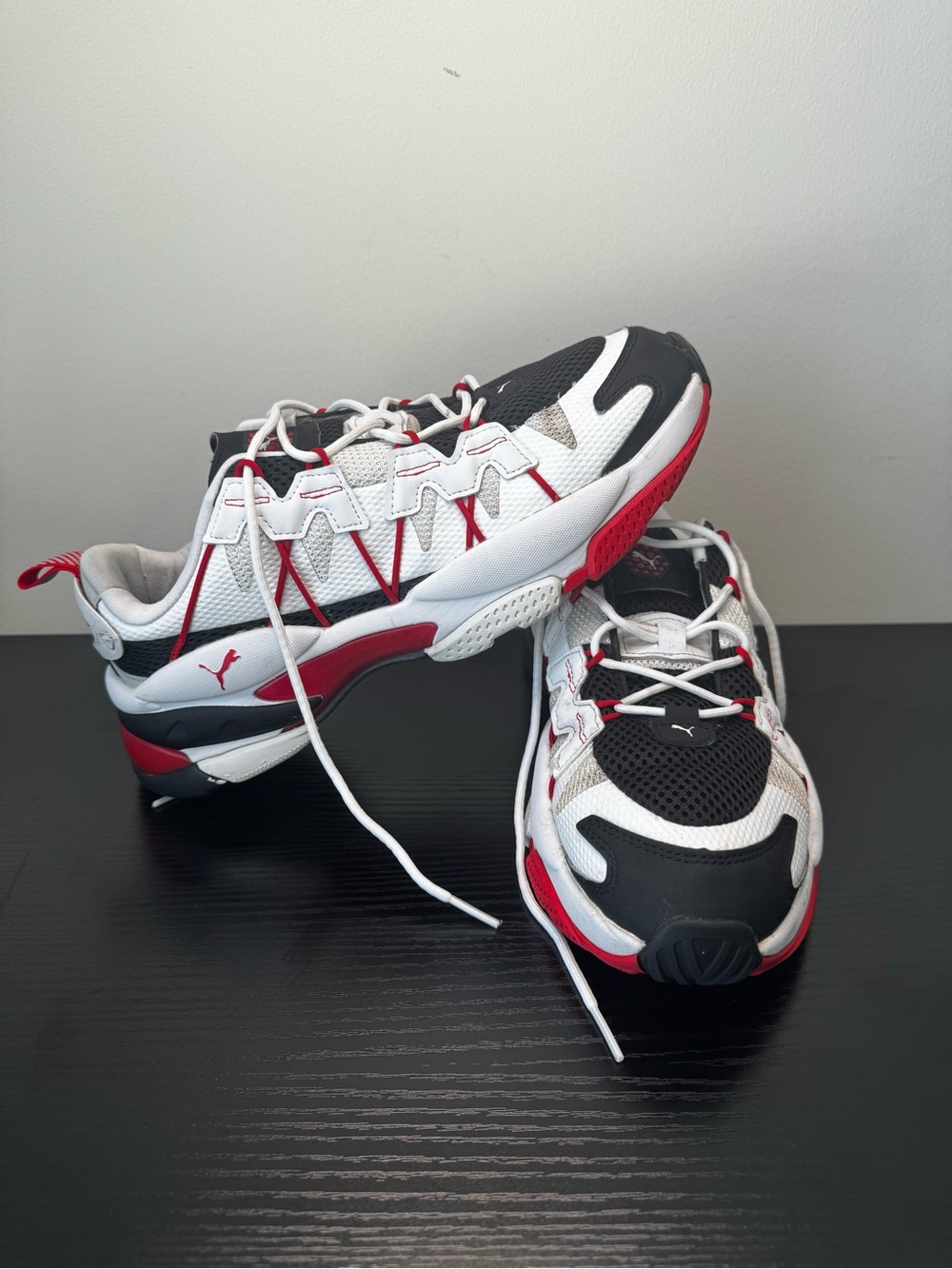 Puma men’s Trail-Style Sneakers in White, Black & Red